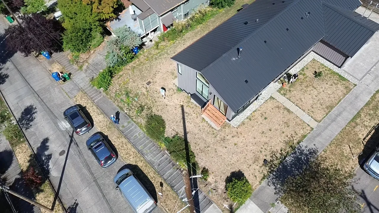 New construction lot before — bare dirt, no landscaping