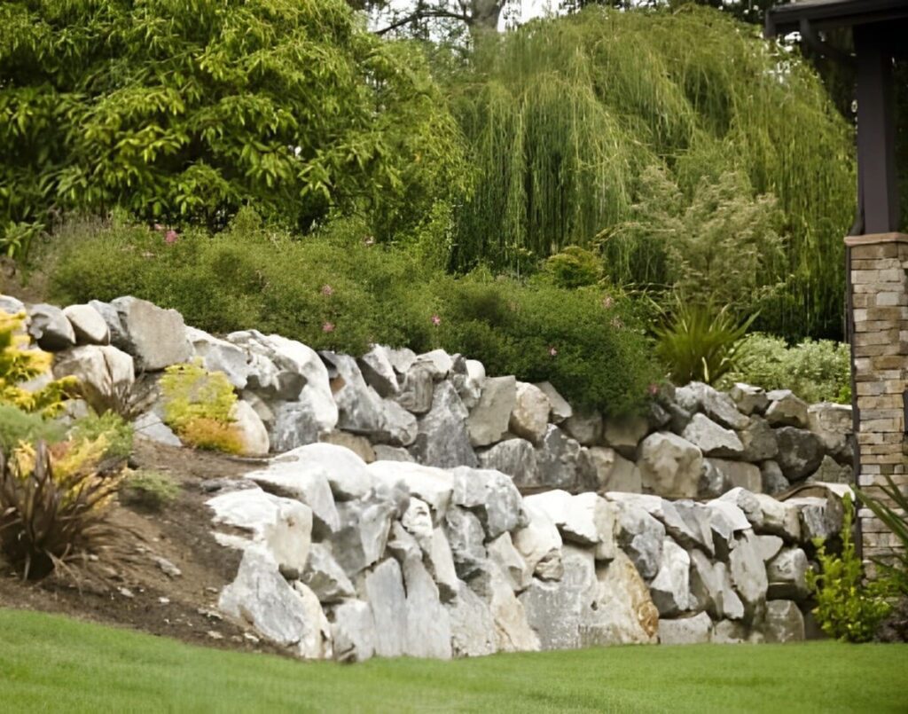 Natural rockery with greenery — retaining wall experts